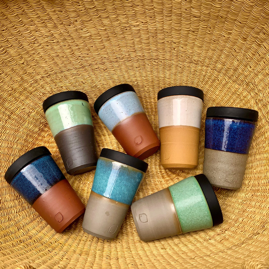 Stunning, locally hand thrown tapered ceramic coffee cups, in assortment of unique  clays and glazes . Each comes with a  silicon lid.Stylish and sustainable  Australlian design.