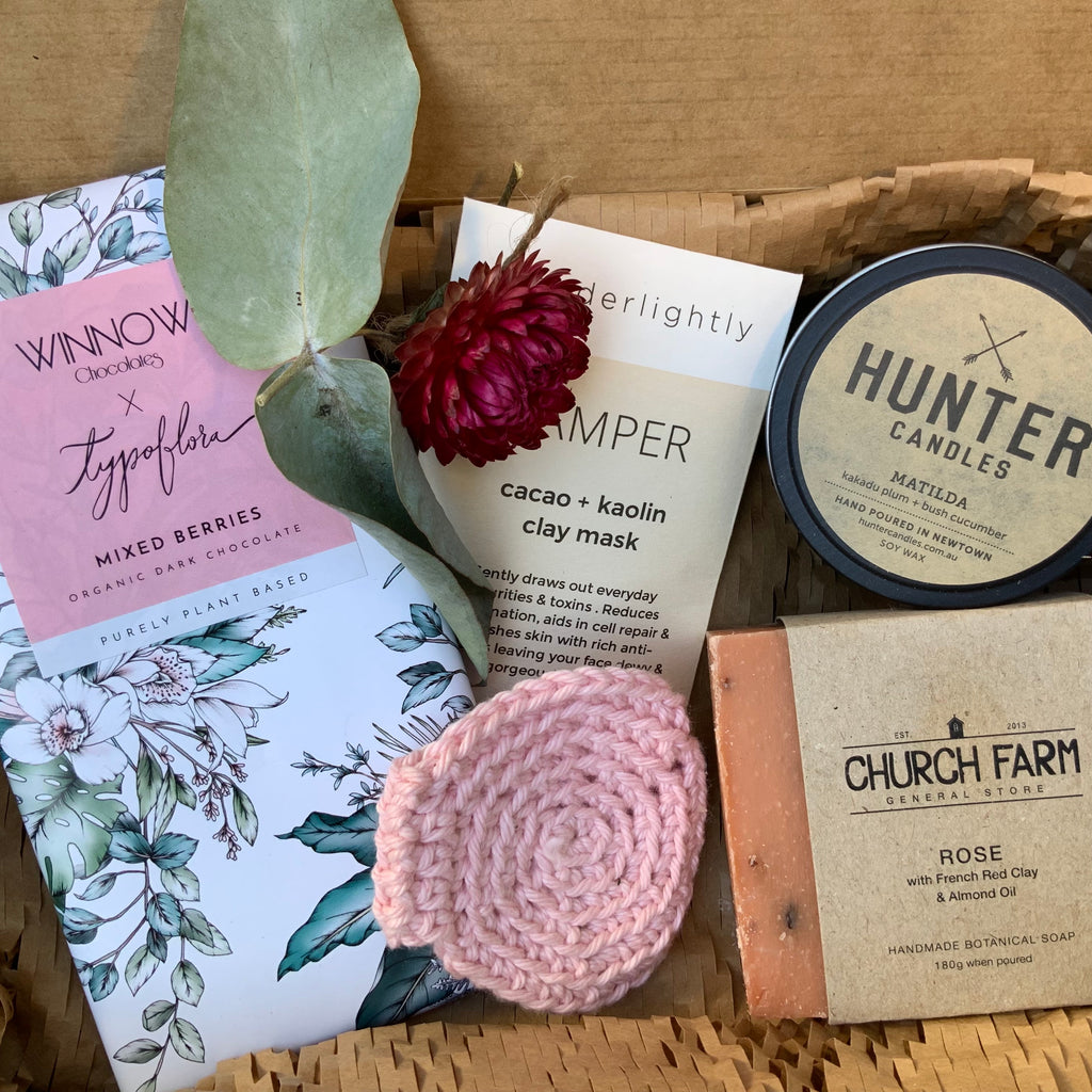 Australian made 'Chocolate in the Bath' eco friendly Gift Box from Asiki. Brown kraft cardboard box contains organic chocolate, pamper clay face mask, reusable make up remover wipe, scented soy candle and handmade botanical soap. 