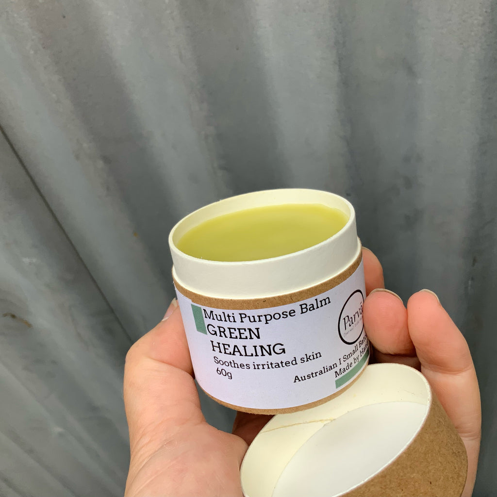 An opened cardboard container of Parva Skincare' Green Healing Balm. Available from Asiki. 