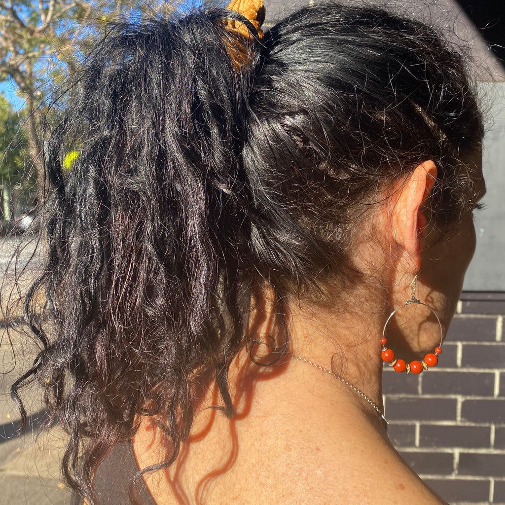 Woman wearing Yellow, Plastic Free, Cord Hair Scrunchie. Made in Australia by Asiki, Erskineville, Sydney.