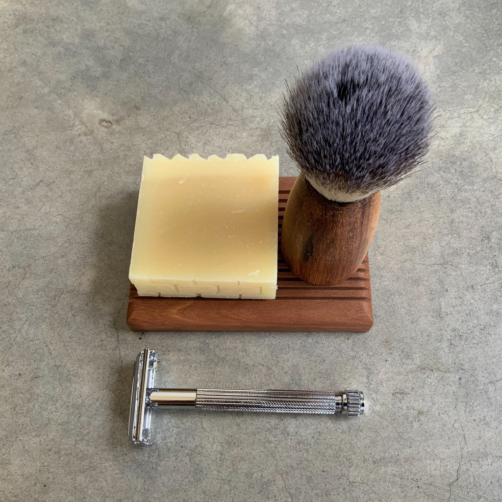 A photo of a Parker Safety Razor with a Shave Brush and Shave Soap plus wooden soap rest. Available from Asiki. 