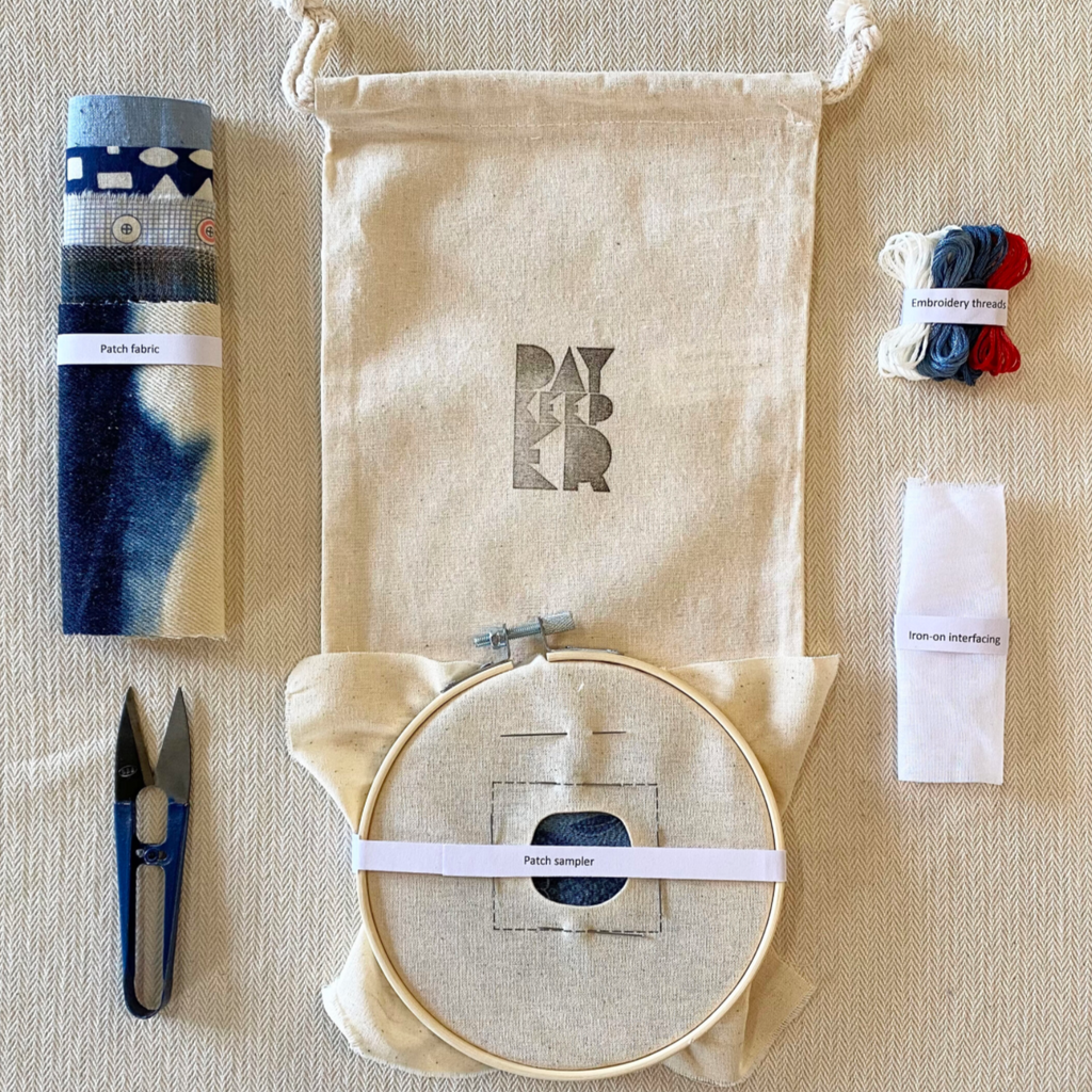Photo of a Day Keeper brand Visible Mending Embroidery Kit with cloth, hoop, threads, and snippers. Available from Asiki, Sydney, Australia. 