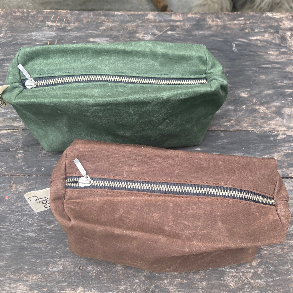 Waxed Canvas Toiletry Bags in green and brown from Asiki
